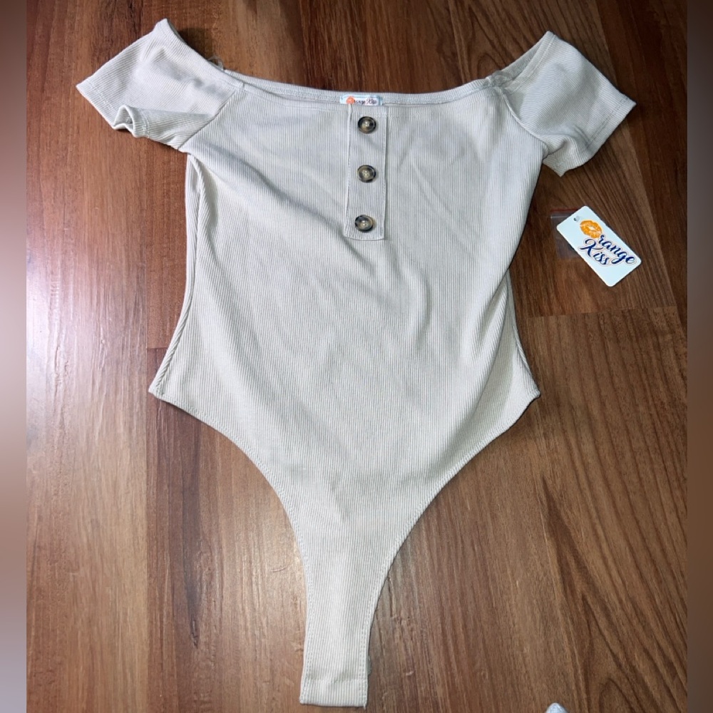 Cream color, off shoulder, bodysuit. New with tag